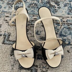 CHANEL Black and Cream Heels with Bow Detail
